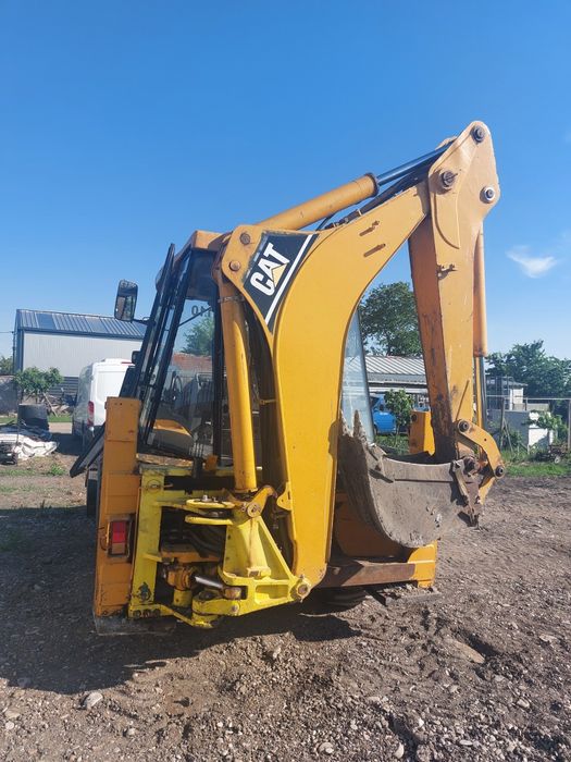 Buldoexcavator Caterpillar