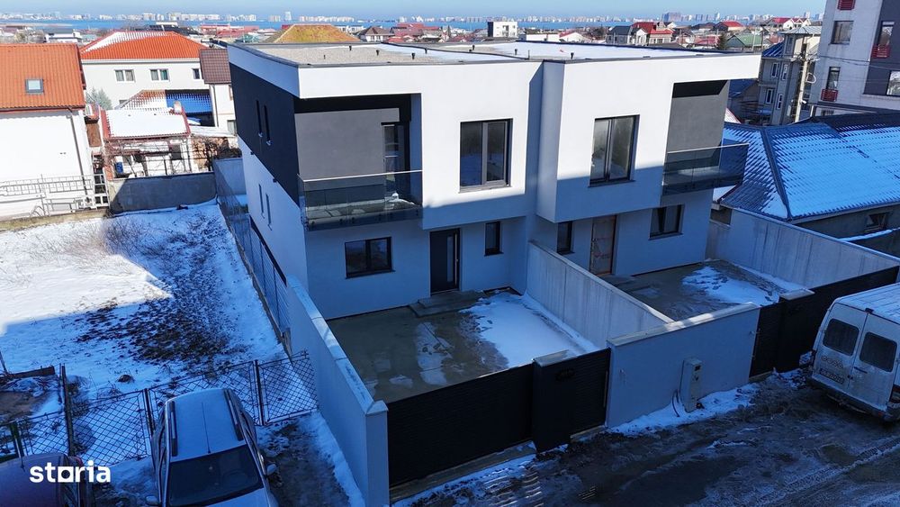 Casă modernă P+1E, structură solidă și izolație fonică.