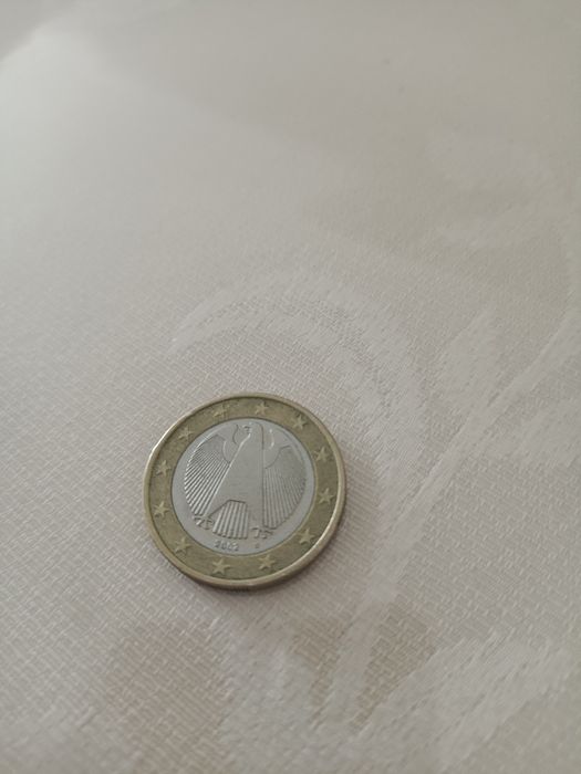 Монета достоинством 1 и 2 евро