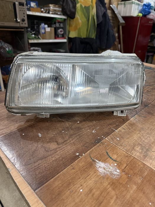Фара пассат б4 левая hella оригинал