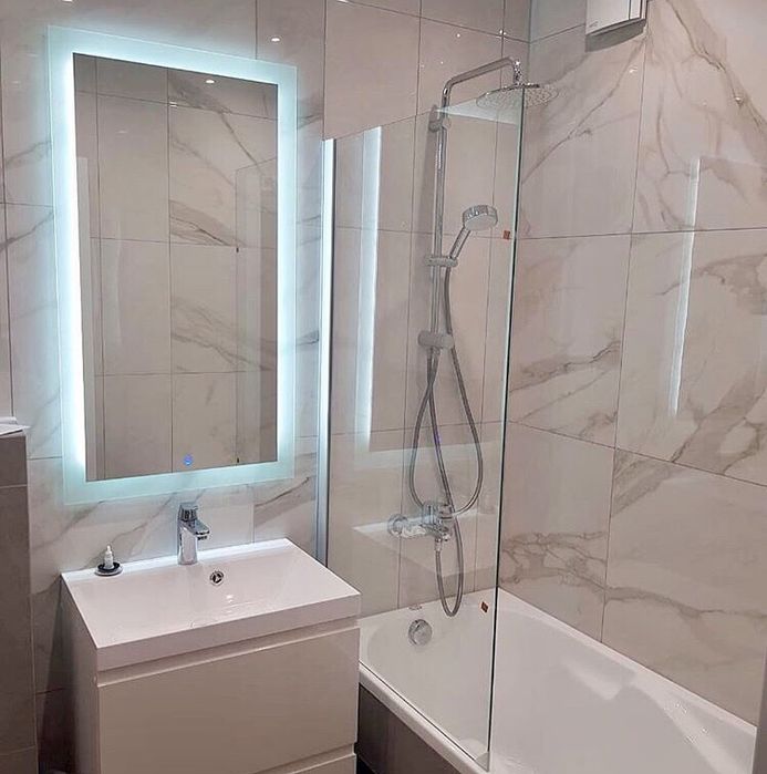 Стеклянные шторки для ванной