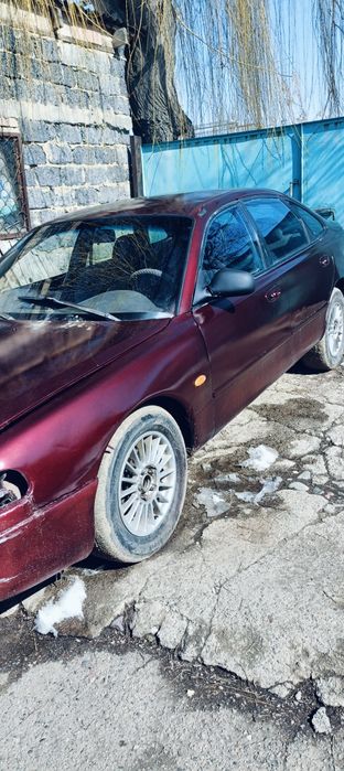 Машина Мазда кронус