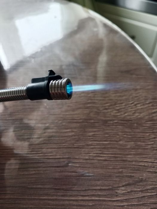 Зажигалка с выдвижным носом .