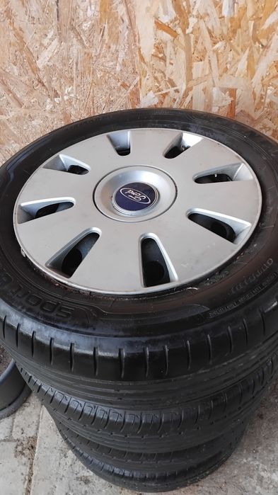 Anvelope ford, cu jante și capace set de 4 bucati