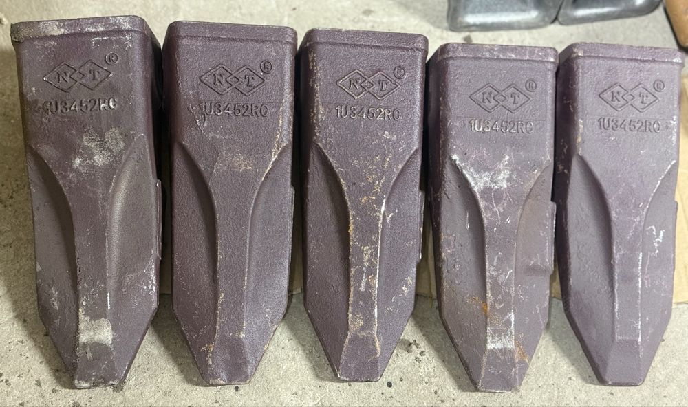 Продам коронки зубья адаптера на экскаваторы