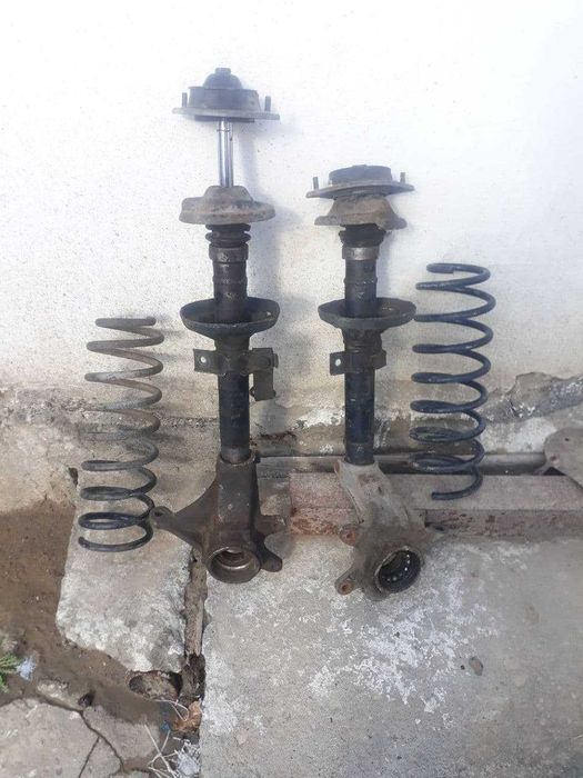 Форд эскорт .Стойки ,пружина