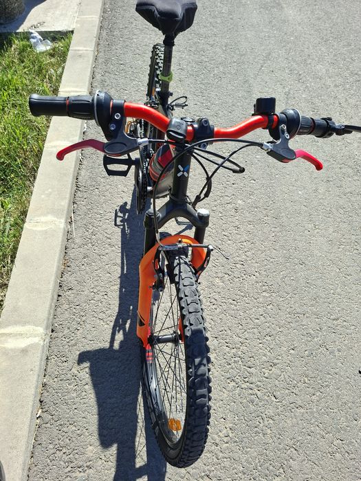 Vand bicicleta B-twin rockrider 500 pret 550 lei