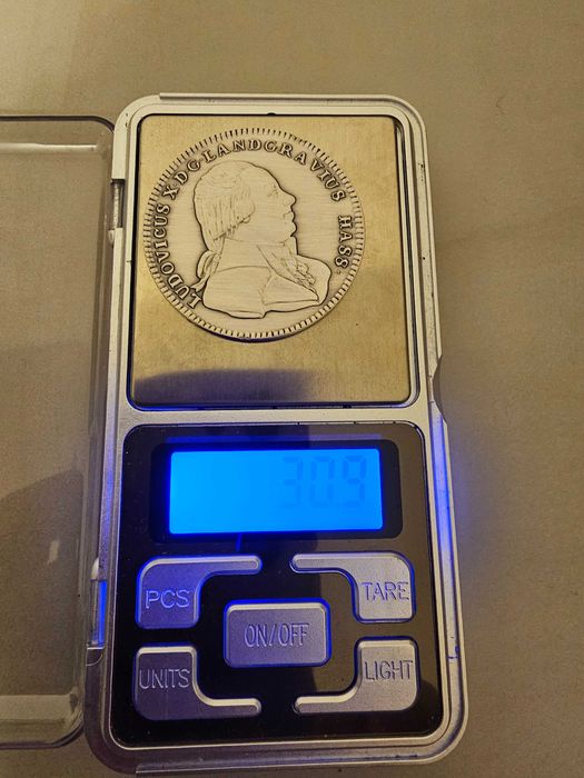Vând moneda de argint