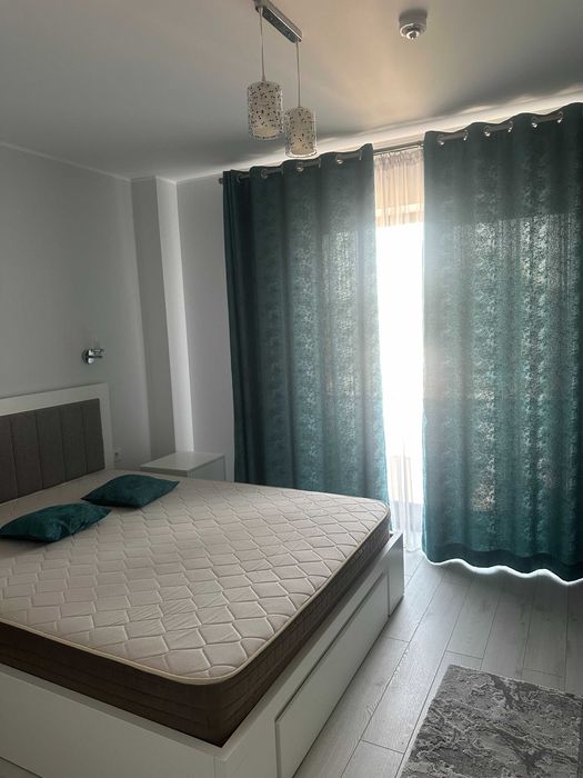 Ofer  spre inchiriere  apartament cu loc parcare si boxa demisol incluse