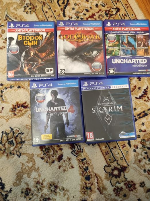 Игры на PS4 Skyrim, uncharted1-4, God of war и Second son