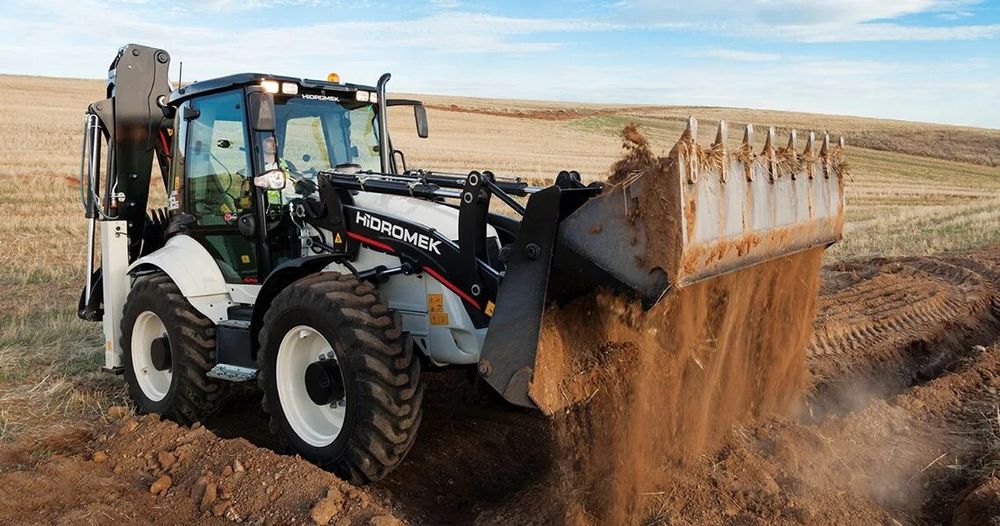 Услуги экскаватора-погрузчика.