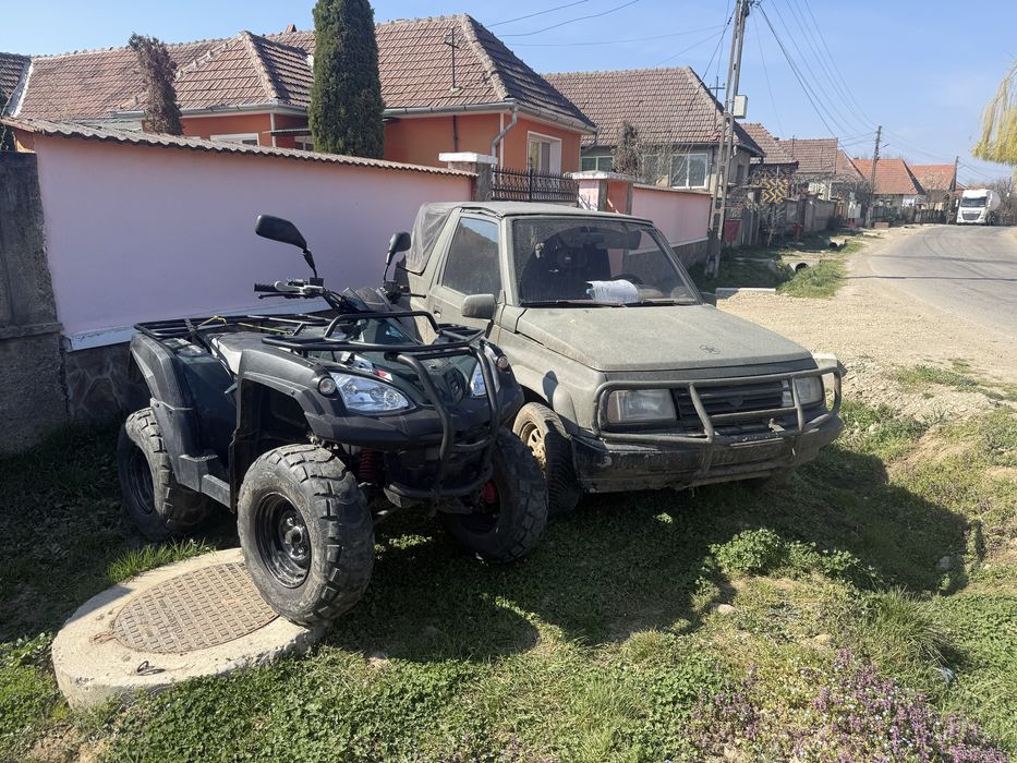 Atv 320 adly nr negre și Suzuki Vitara 1.6 i