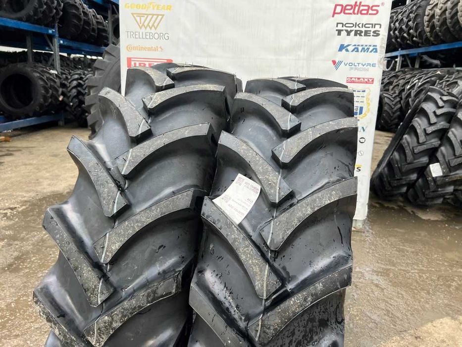 Cauciucuri noi 14.9-26 cu 10 pliuri marca OZKA pentru combina