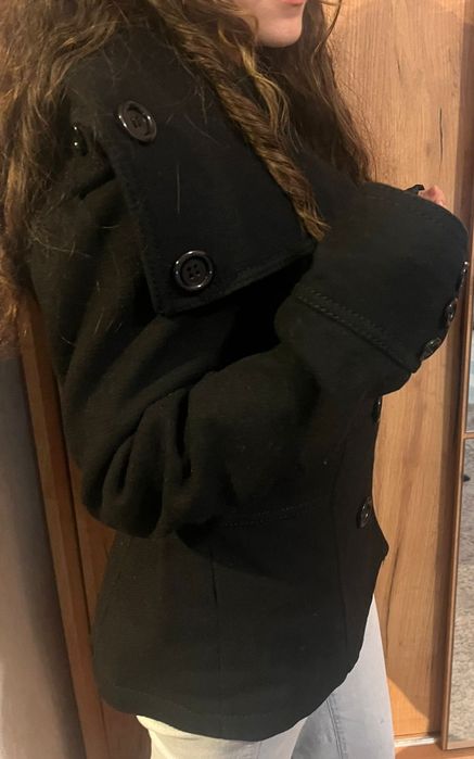 Palton în stare aproape nou