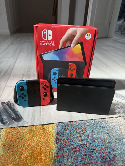 Nintendo Switch + 2 jocuri + Dock + Husă + Accesorii – stare foarte bună