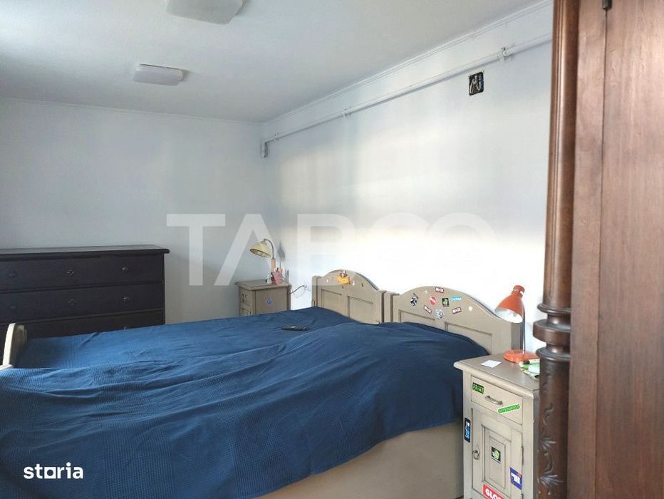 Apartament de vanzare 105 mp 3 camere curte 340 mp in acte Cisnadie