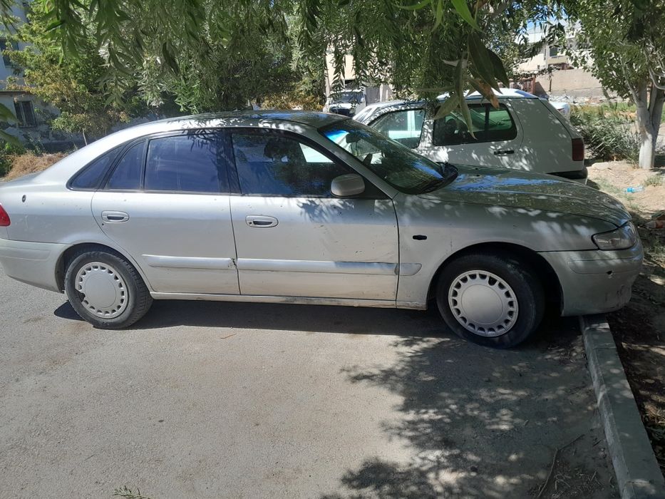 Мазда 626 птичка