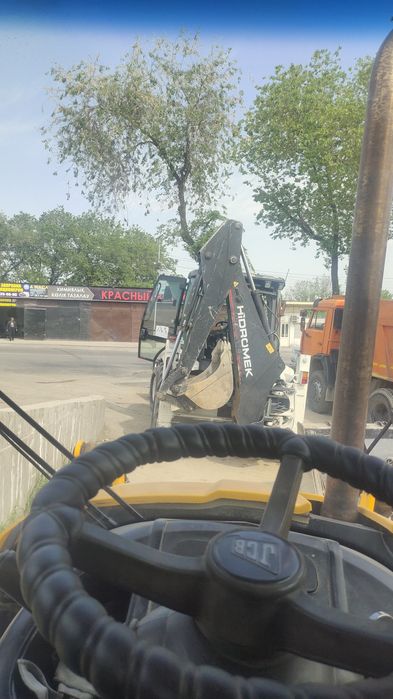 Погрузчик  эксковатор.3в1