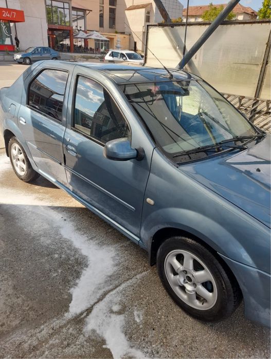 Dacia Logan, 1.6 16V • 2006 • 180.000 KM • Albastru • Navigație