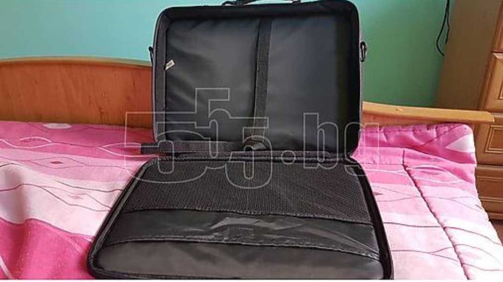 Продавам чисто нова чанта за лаптоп, черна с прегради