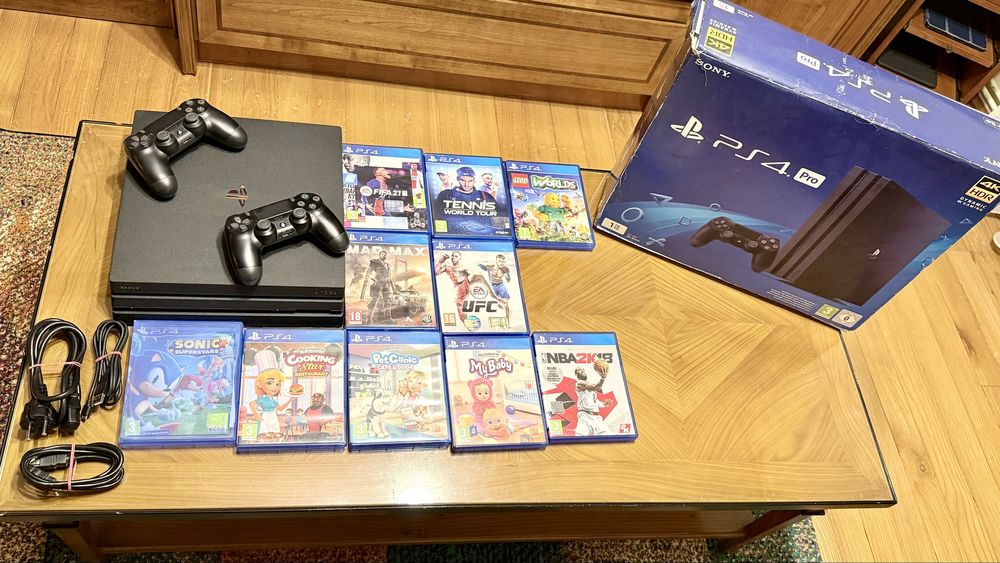 PS4 Pro 1TB + 2 manete + 10 jocuri – stare foarte bună