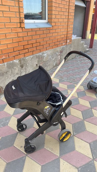 Продам автокресло Doona