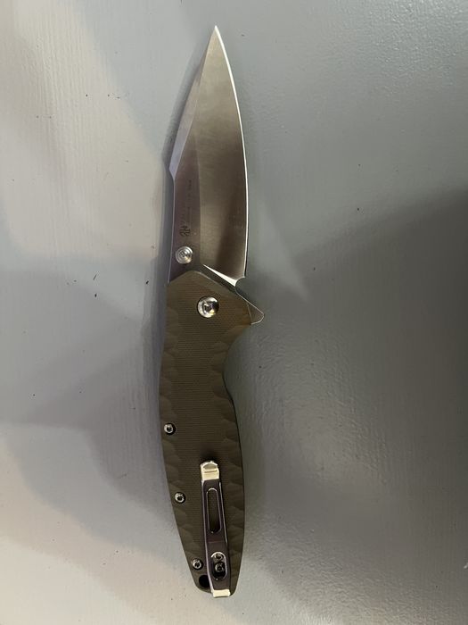 Briceag Ruike Otel inoxidabil 12C27, maner din G10