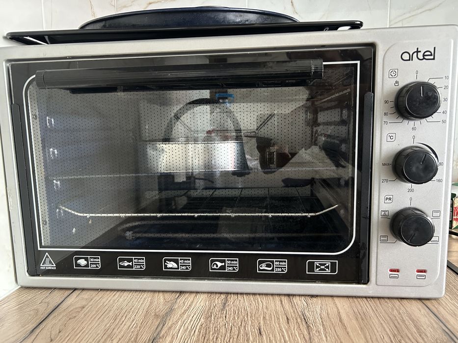Продам б/у печь артел 36л