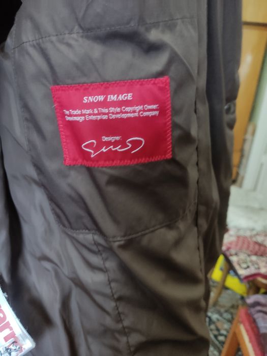 Пуховик женский с капюшоном.