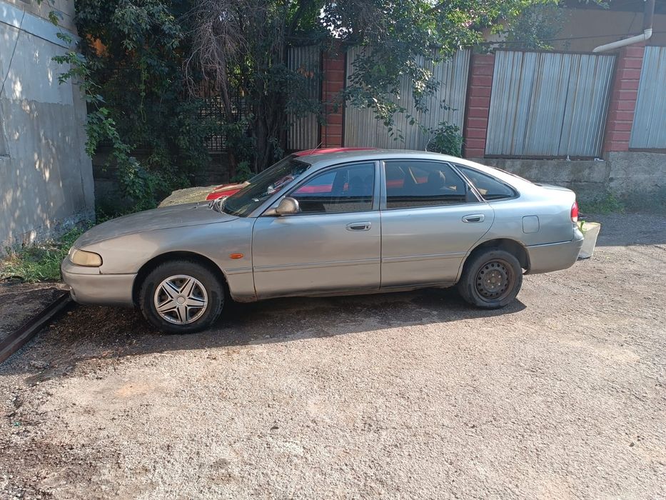 Мазда кроус 626 свет серыи