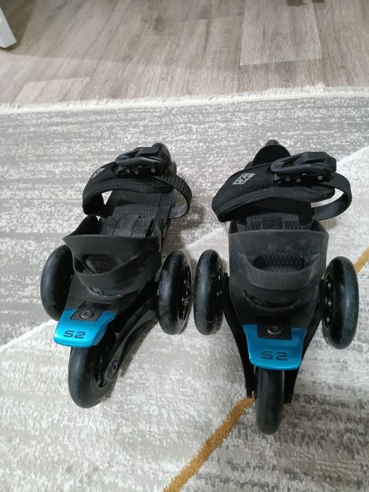 Роликовый коньки