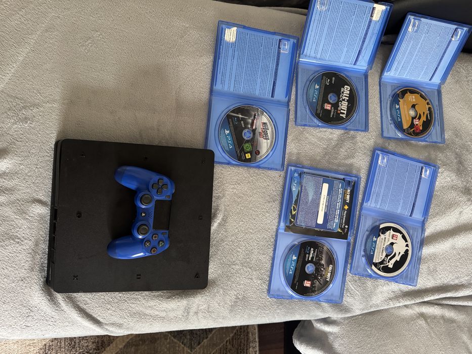 PS4 Slim 1TB + Controller Albastru + GTA V + 5 Jocuri – Pachet Complet