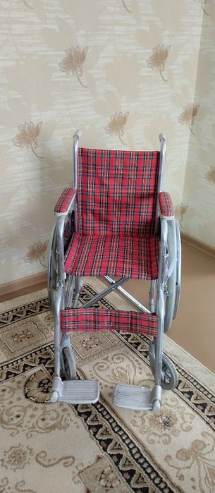 Инвалидная коляска.