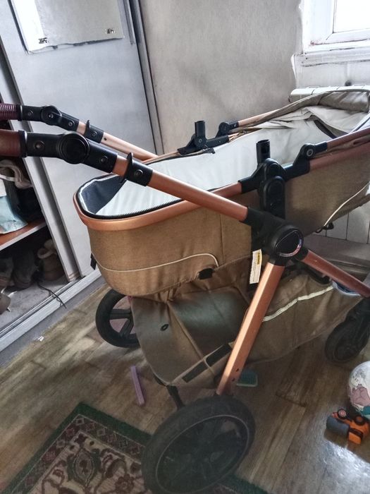 Продам коляску и стульчик