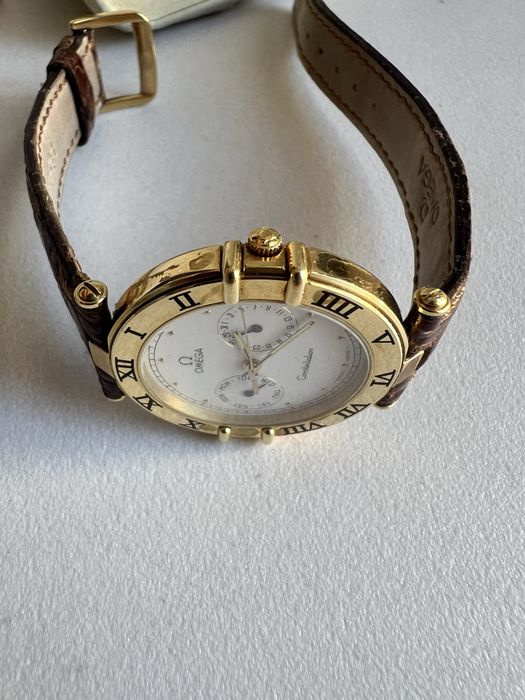18 k aur Omega Constellation Day-Date,quartz ref.196.1070 cal.1444