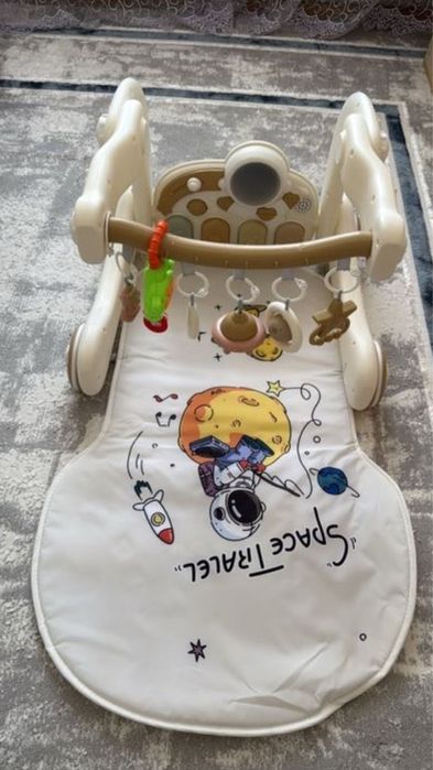 Продам музыкальный коврик и ходунок