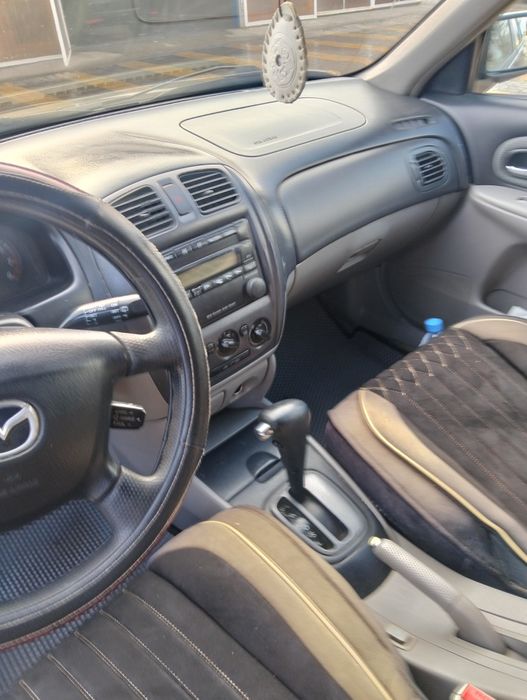 Мазда 323 находу