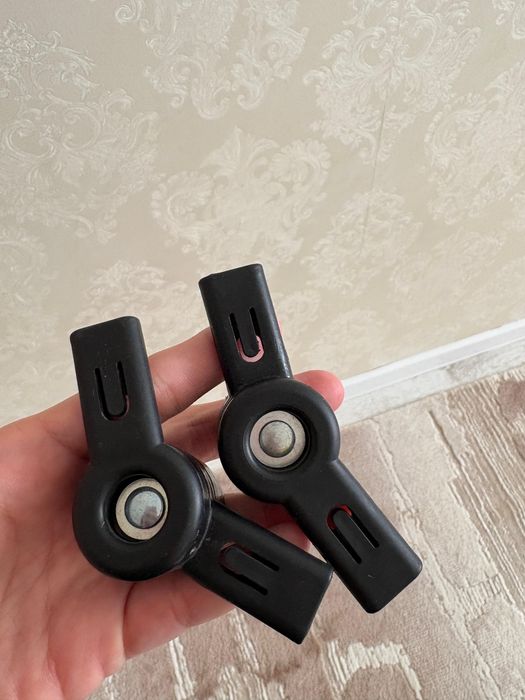 Регулятор капюшона коляски