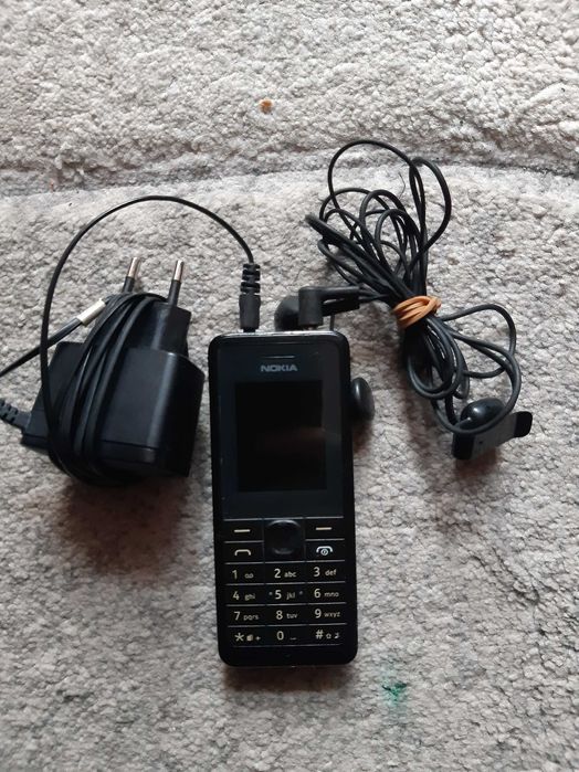 Мобилен телефон NOKIA 107, със зарядно у-во и слушалки