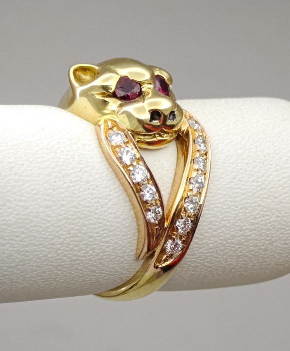 Златен пръстен Cartier с диаманти и рубинии