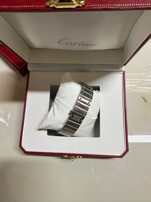 Cartier Santos silver skeleton
