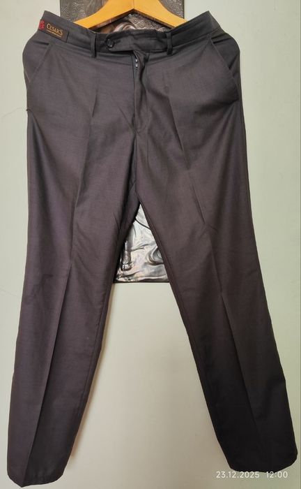 Брюки новые 48 размер.Цвет тёмный шоколад