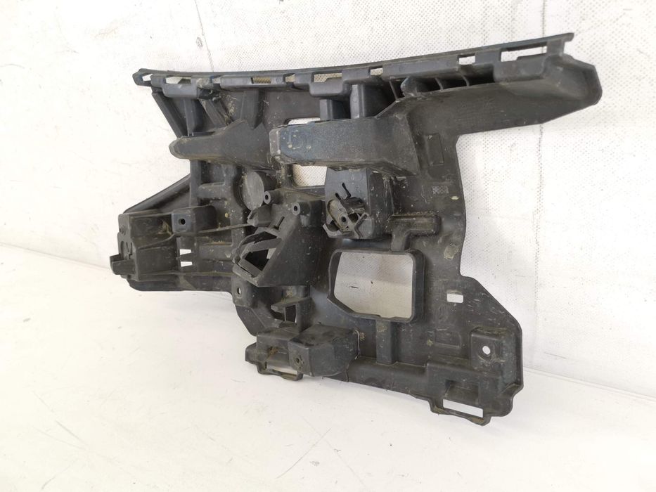 Ляв носач на предна броня Волво В40 2 [ - ] Оригинален, в добро състоя