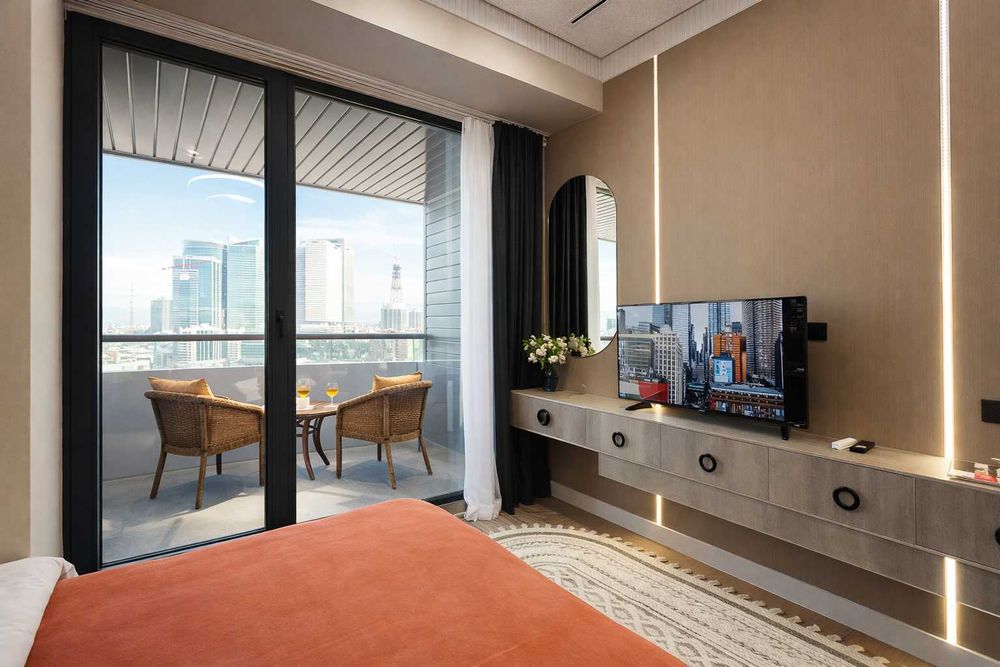 Дизайнерская студия с продуманным интерьером с видом на Ташкент сити