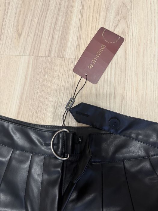 кожаные брюки женские