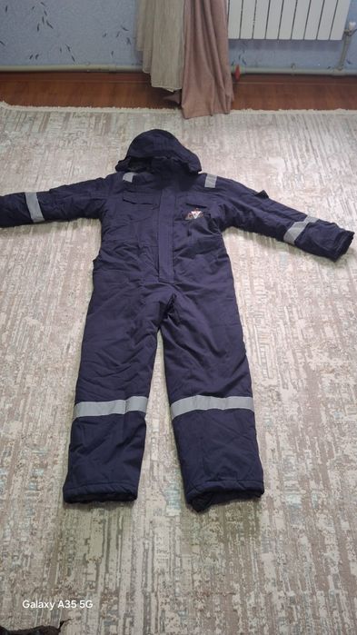 Зимний комбинезон новый очень теплый