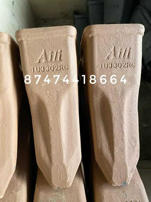 Зубья,адаптеры,фиксаторы,коронки