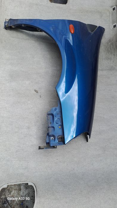 калник Nissan Almera Tino  2000-2006