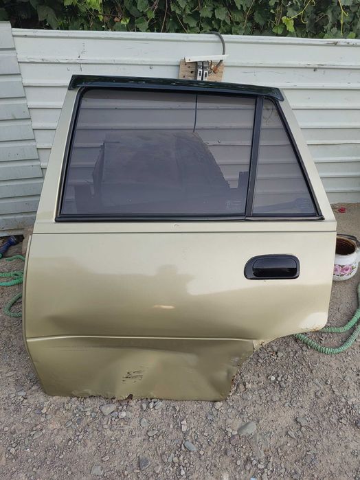 Двери нексия 2009