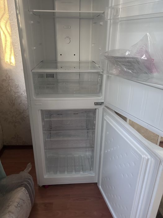 Новый холодильник.